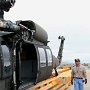 JUNE – Honorable Mention - UH-60 Recovery Trailer Demonstration<br />David B. Cummins, Local Lodge 2003, Army Fleet Support, Fort Rucker, AL<br />Union Steward James T. Waters examines the placement of a UH-60 Aircraft during the initial testing of a prototype recovery trailer.<br />